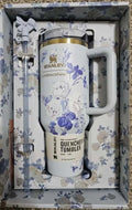 Decorative wall art with a wine bottle and glass on a textured background