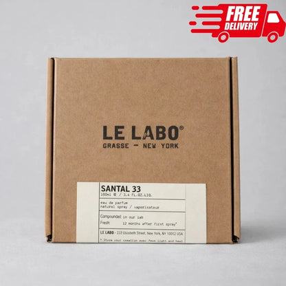 A square brown kraft paper box for LE LABO Grassse - New York, featuring a white label for Santal 33. A red 'FREE DELIVERY' graphic is overlaid in the top right corner.