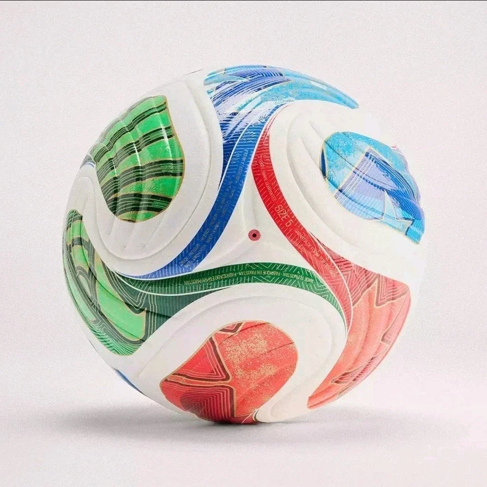 A soccer ball with a white base and vibrant multicolor patterns in green, blue, and red, photographed on a light gray studio background.